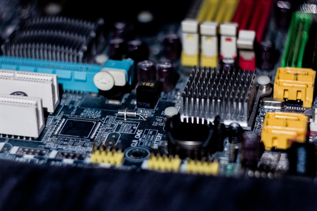 a close up of a computer motherboard with wires and connectors